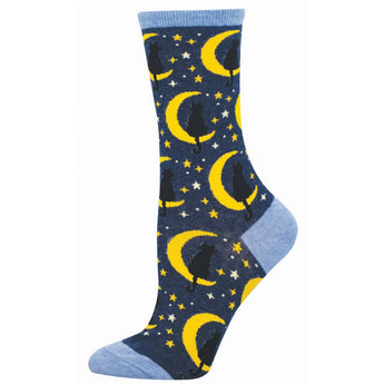 Dark blue sock with a yellow moon and star pattern with black cats sitting on crescent moons