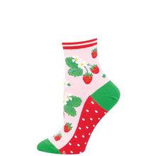 Colorful sock with strawberry pattern on a light pink background